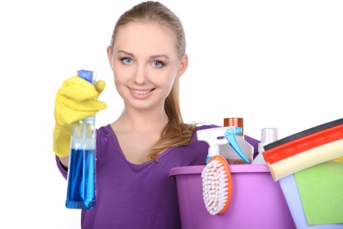 Professional cleaners maintaining a tidy and safe work area